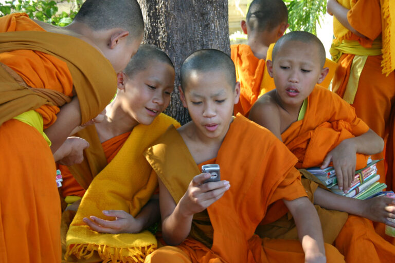 ChiangMai_img_3247 young monks watching mobile phone, Changmai, Thailand