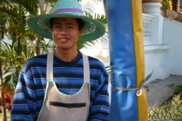man on temple grounds, Changmai, Thailand