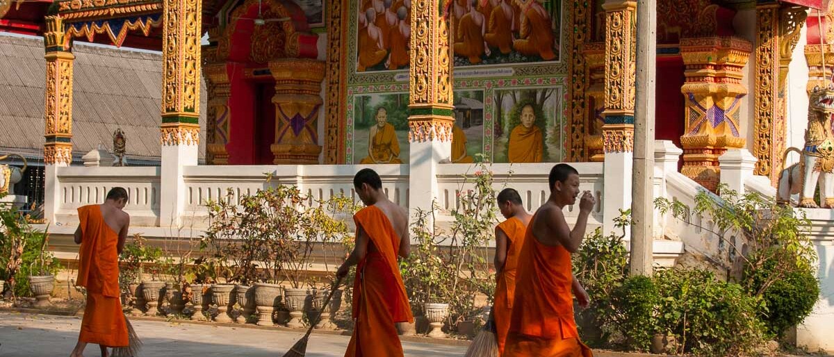 Monks cleaning the temple grounds