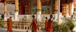 Monks cleaning the temple grounds
