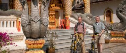 Henk and Eric with bicycles in front of temple