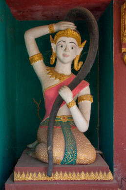 small statue with hair symbolising a river