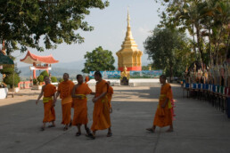 Monks walking on the compound
